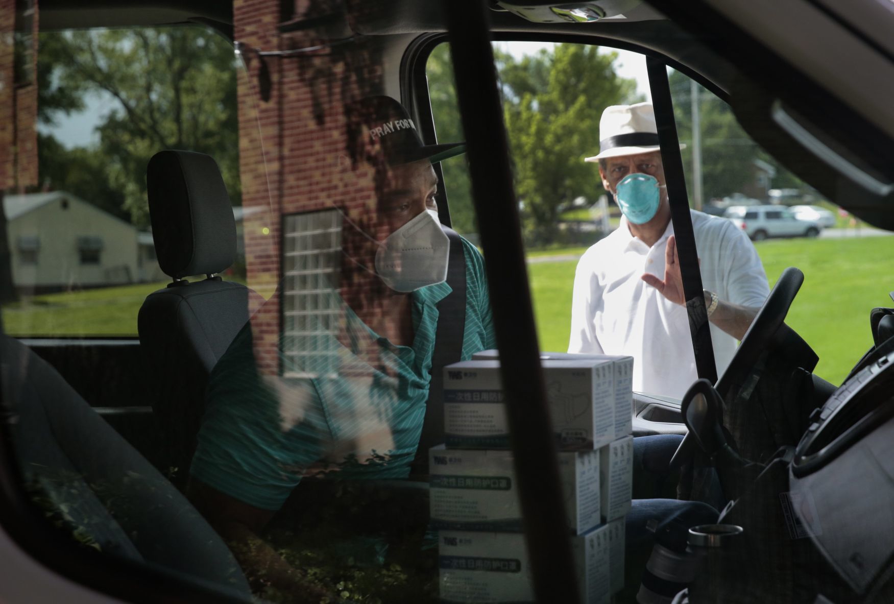 Clergy distributing masks to area churches